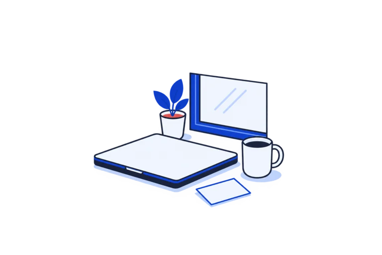 An open laptop with a blank screen beside a cup and small plant